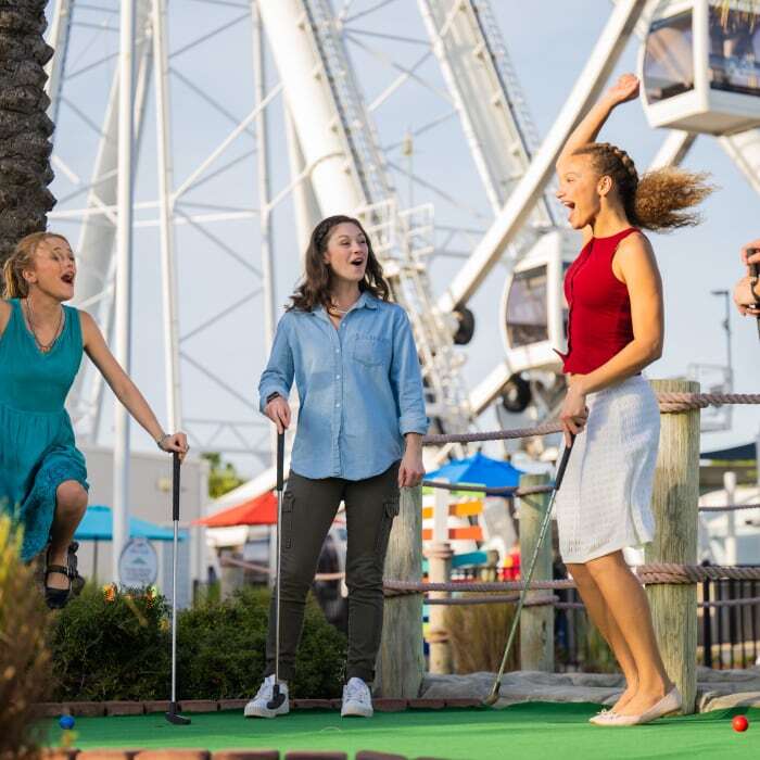 A group enjoying the mini golf at PCB Wheel. 